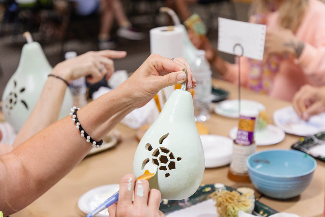 Woman Painting Coastal Themed Gourd at Meadowbrooke Gourds' Coastal Create Your Own Event