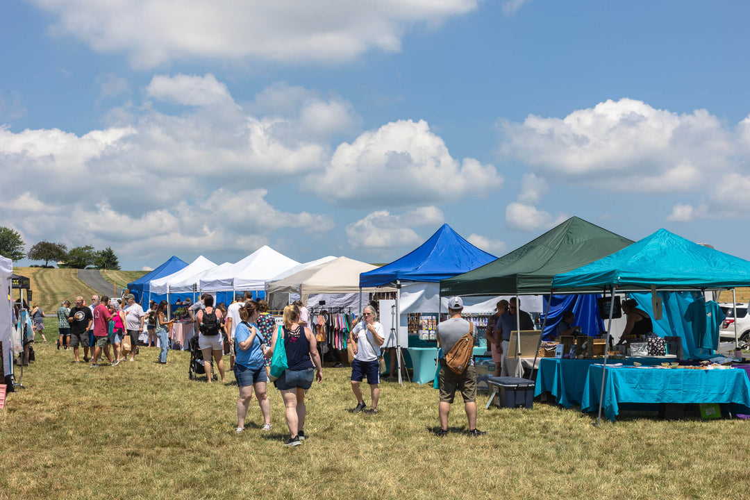 Craft vendors outside at a festival at Meadowbrooke Gourds.