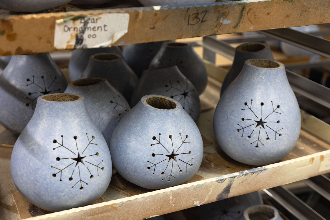 Blue sponged snowflake cutout gourds at Meadowbrooke Gourds.
