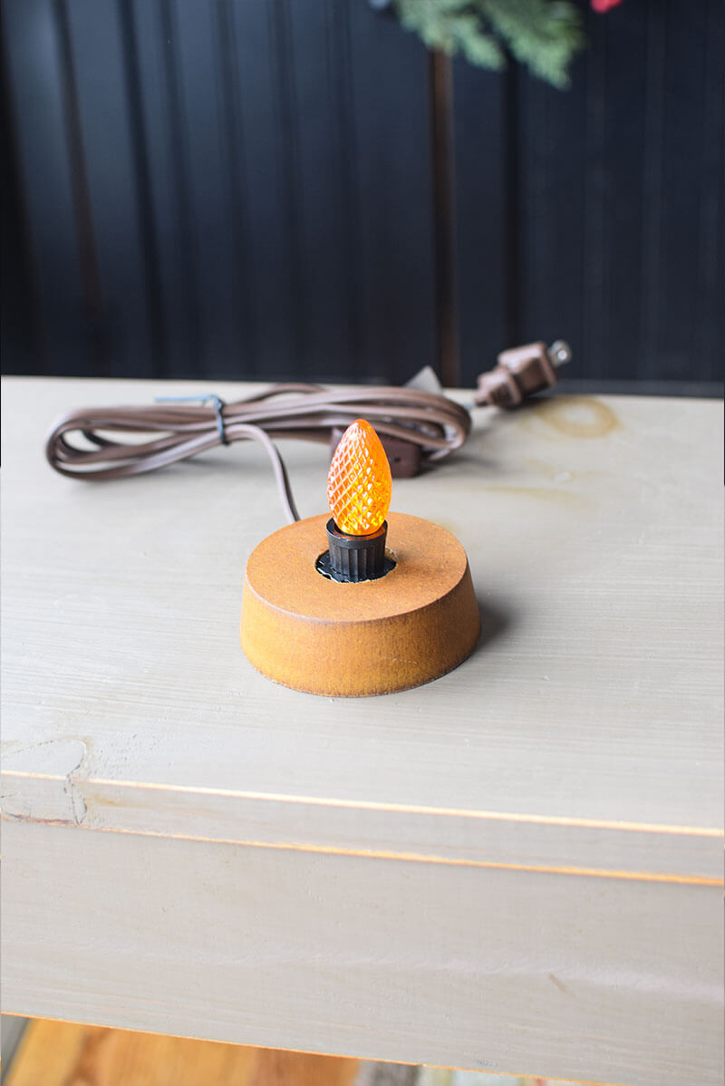Light Base with Orange LED Bulb.
