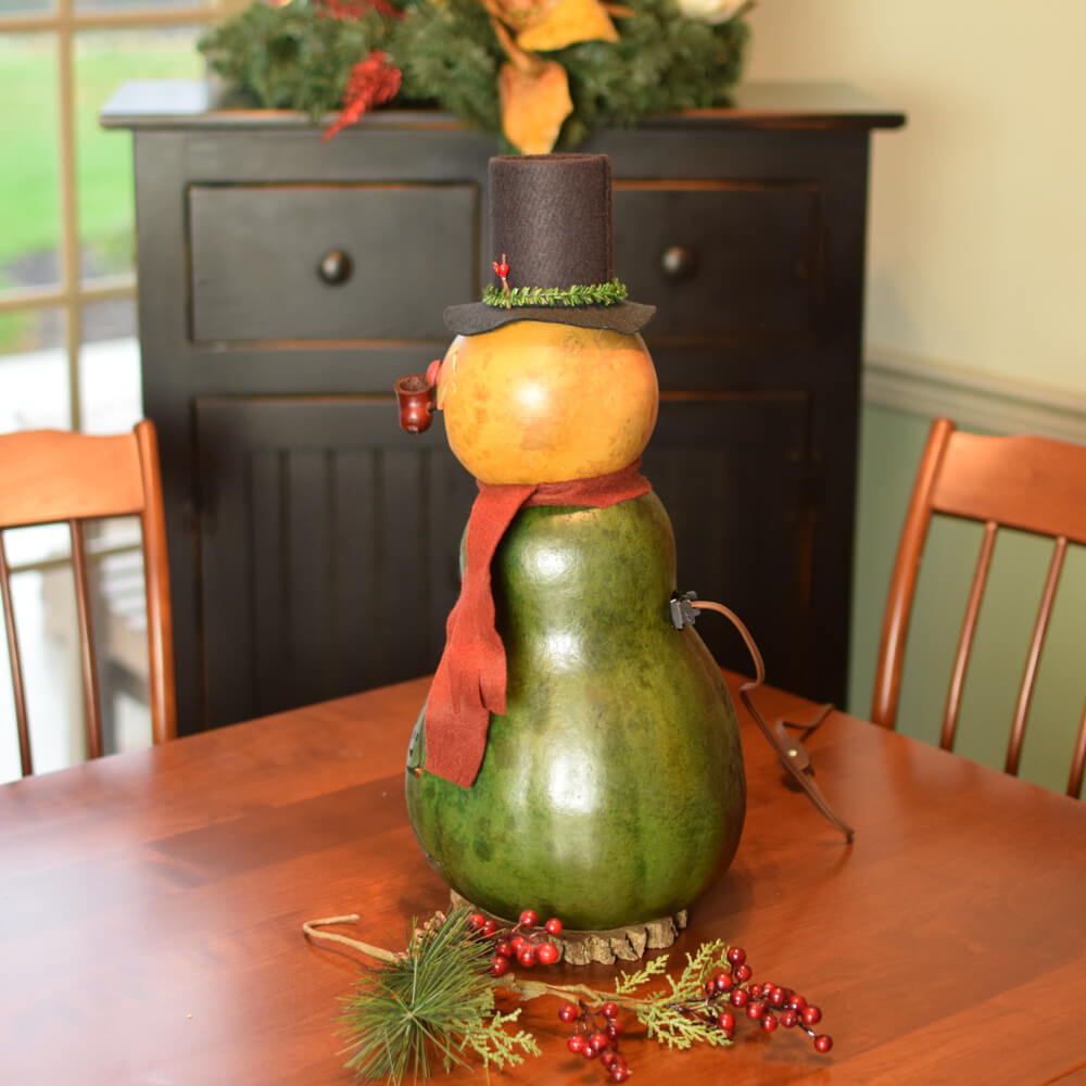 Large Lit Pinewood Snowman Gourd at Meadowbrooke Gourds. Left Side View