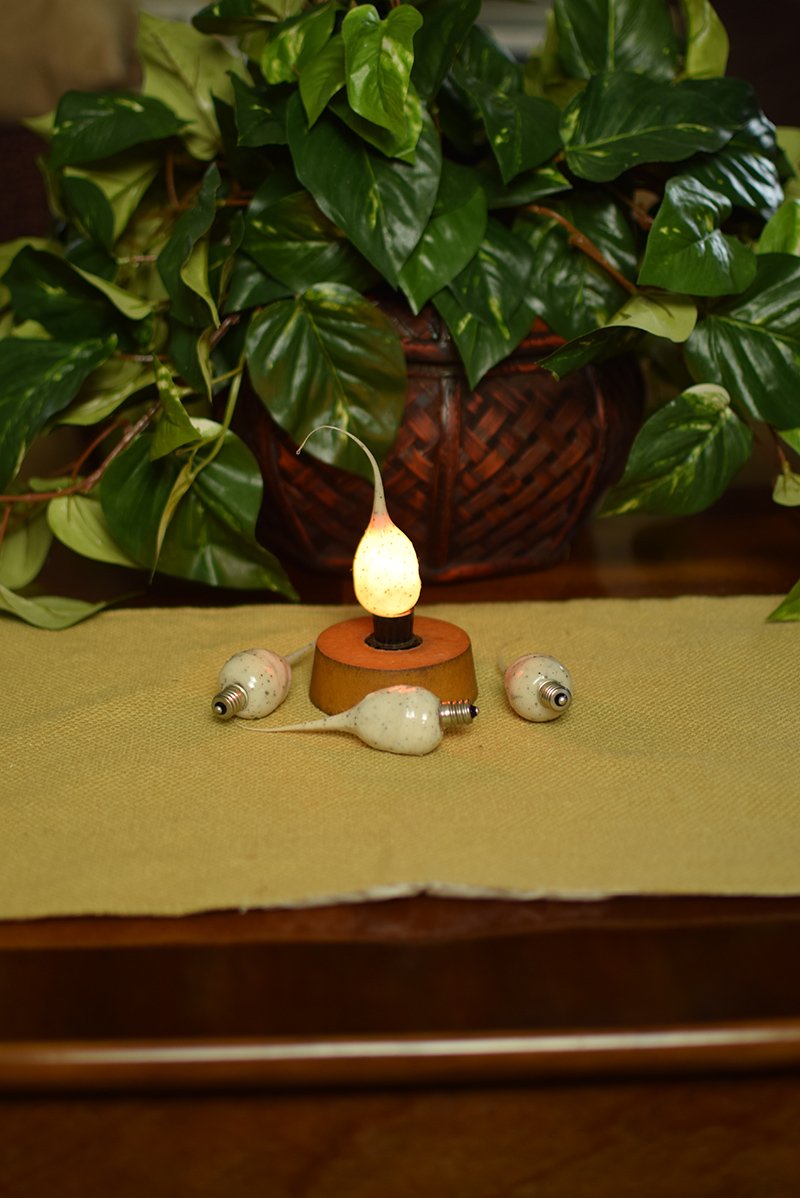 Decorative light bulb in a base