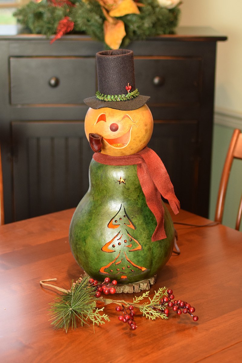 Large Pinewood snowman lit gourd at Meadowbrooke Gourds