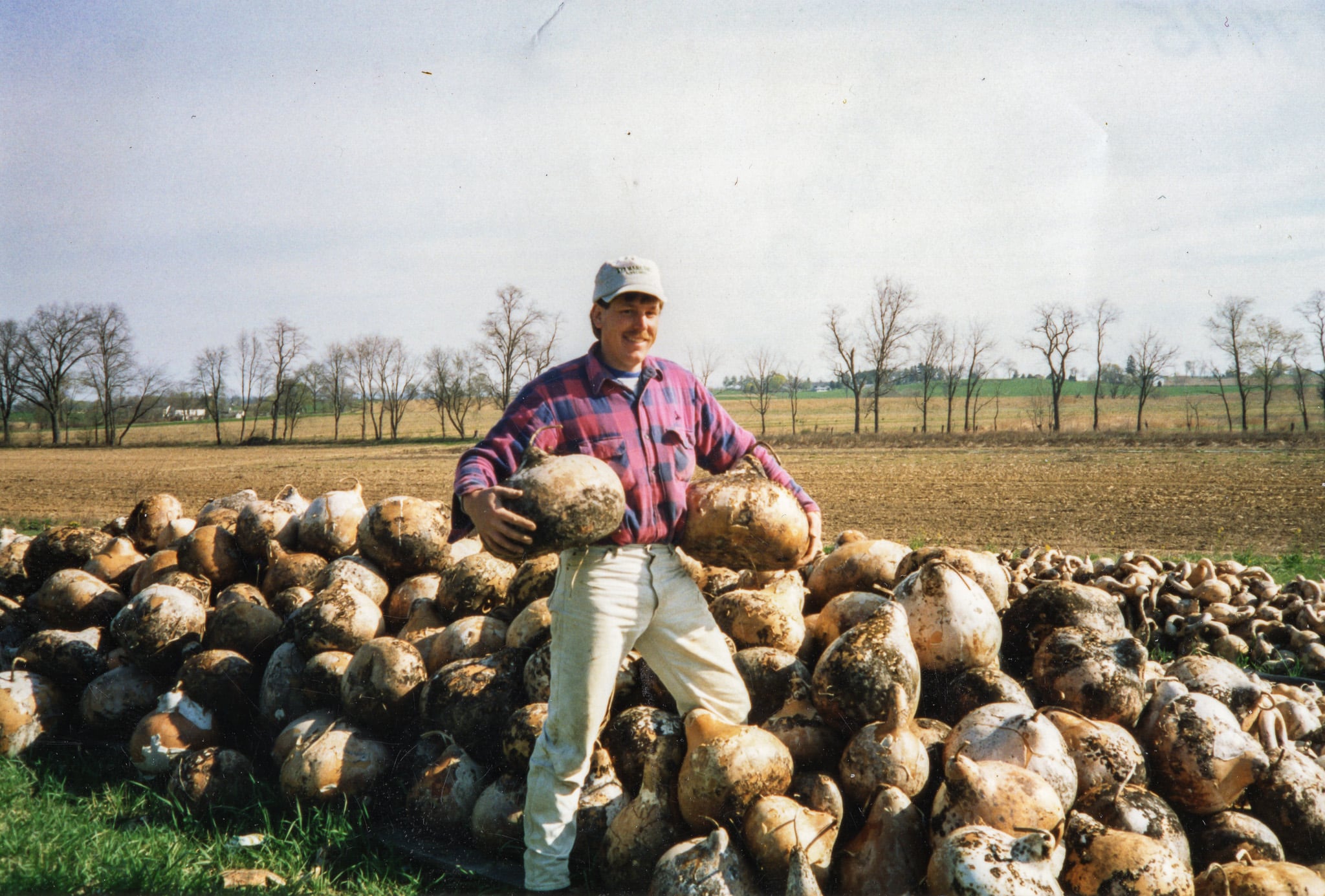 Founder Ben Bear with gourds at the Meadowbrooke Gourds farm. 