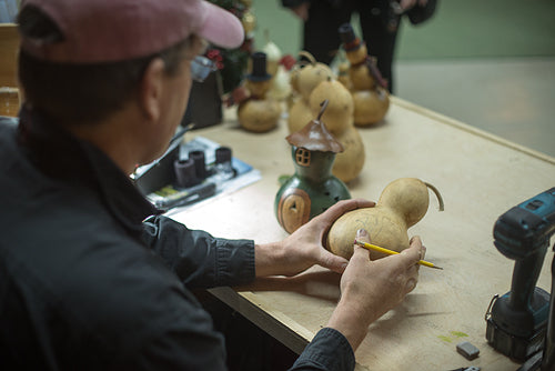 Founder Ben designing a gourd at Meadowbrooke Gourds.