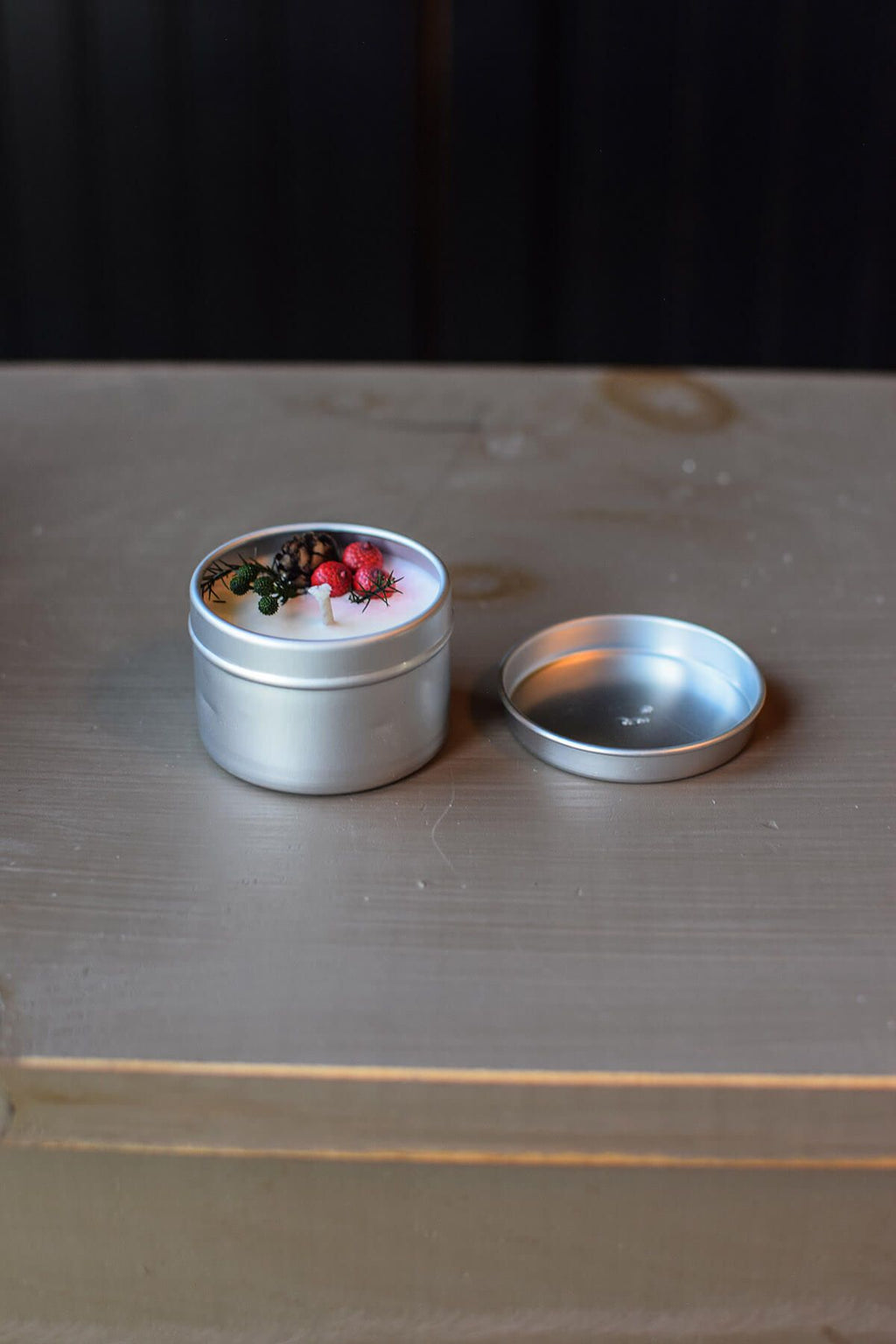 tiny candle in a tin
