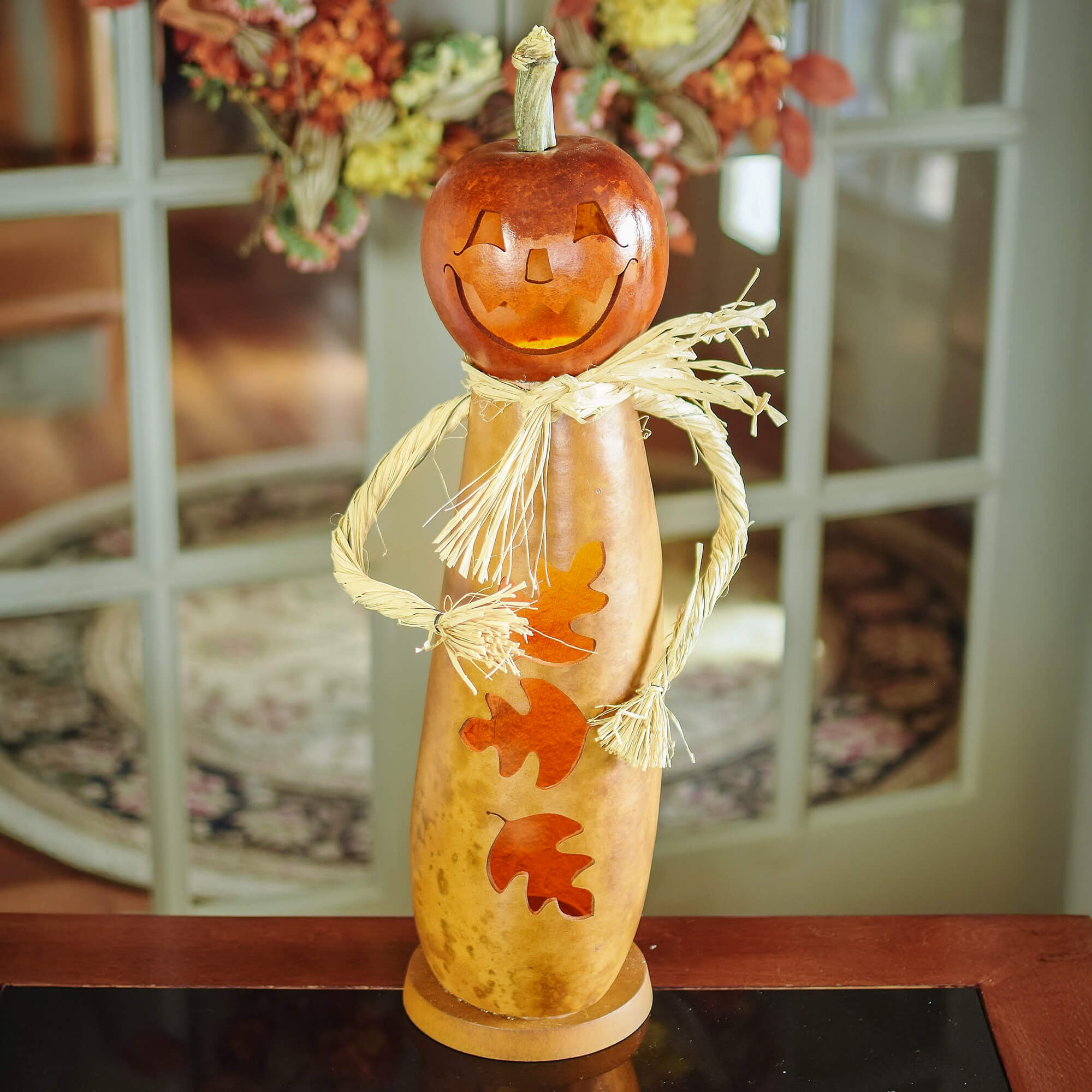Dexter scarecrow lit gourd at Meadowbrooke Gourds