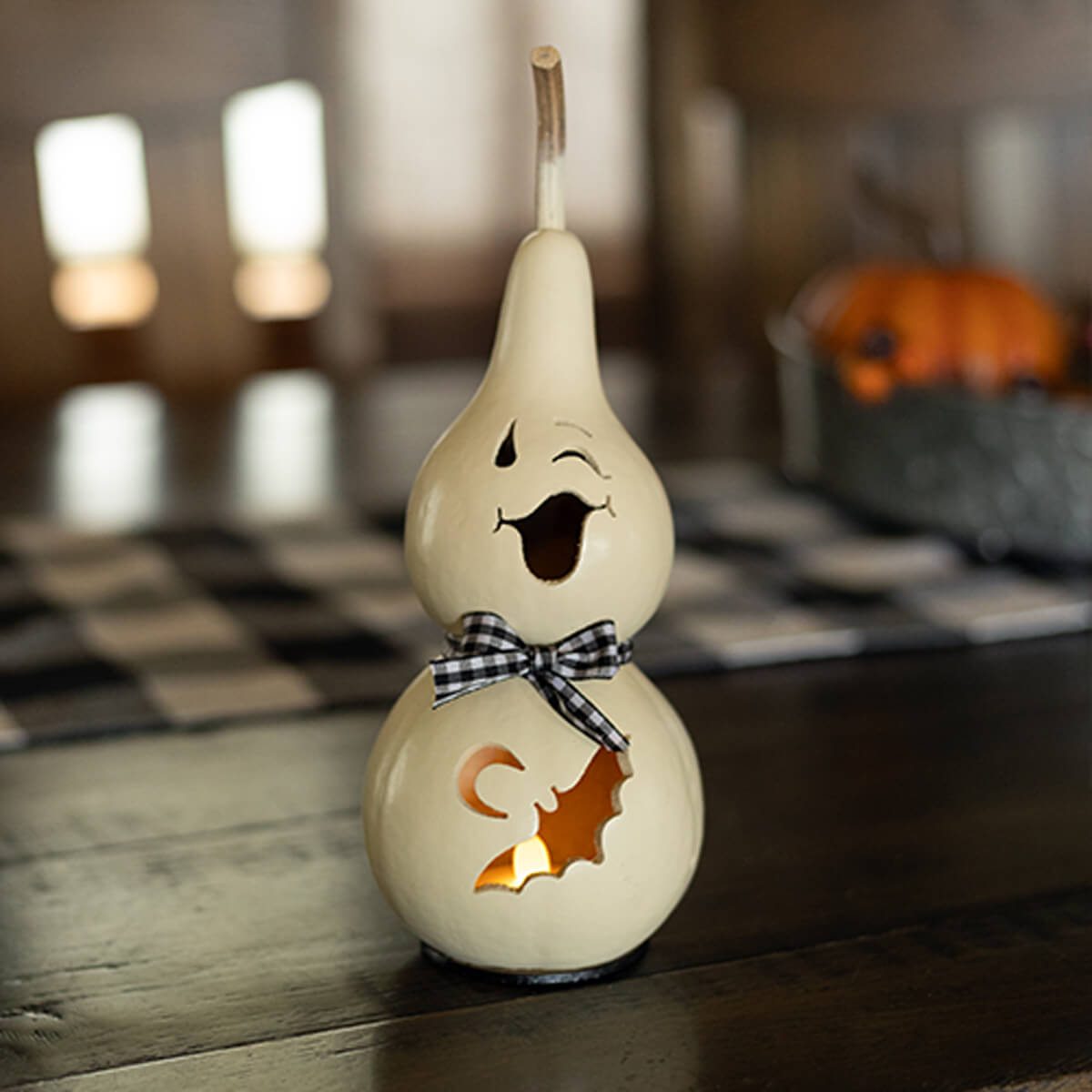 Jake Winking Ghost Gourd with Black and White Bow. 
