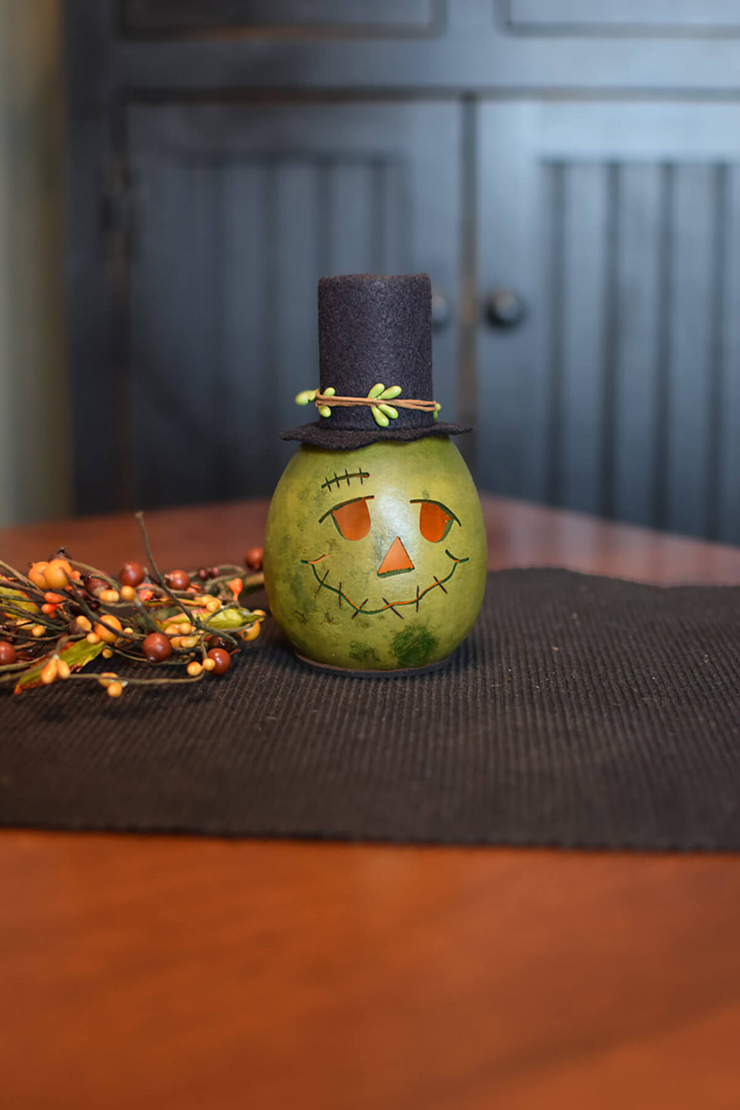 Miniature green Frank gourd at Meadowbrooke Gourds.