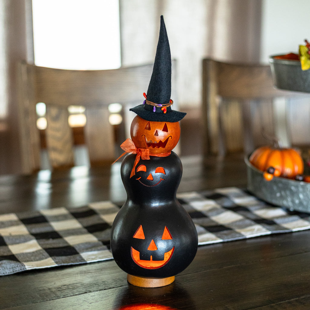 Reba Black and Orange Small Tall Lit Witch front view at Meadowbrooke Gourds.
