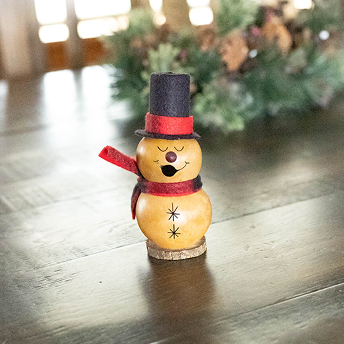 Tiny Caramel Colored Snowman Gourd at Meadowbrooke Gourds. 