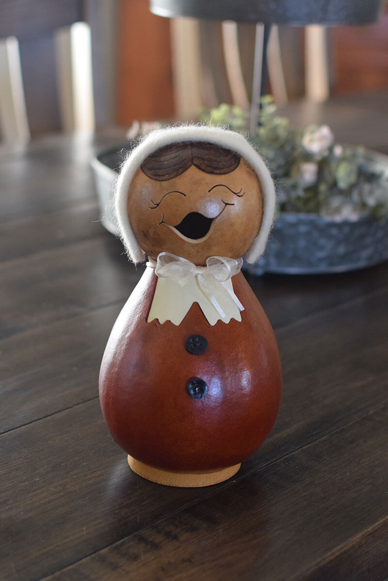 Pilgrim-Woman-Gourd-Fall-Design-Meadowbrooke-Gourds