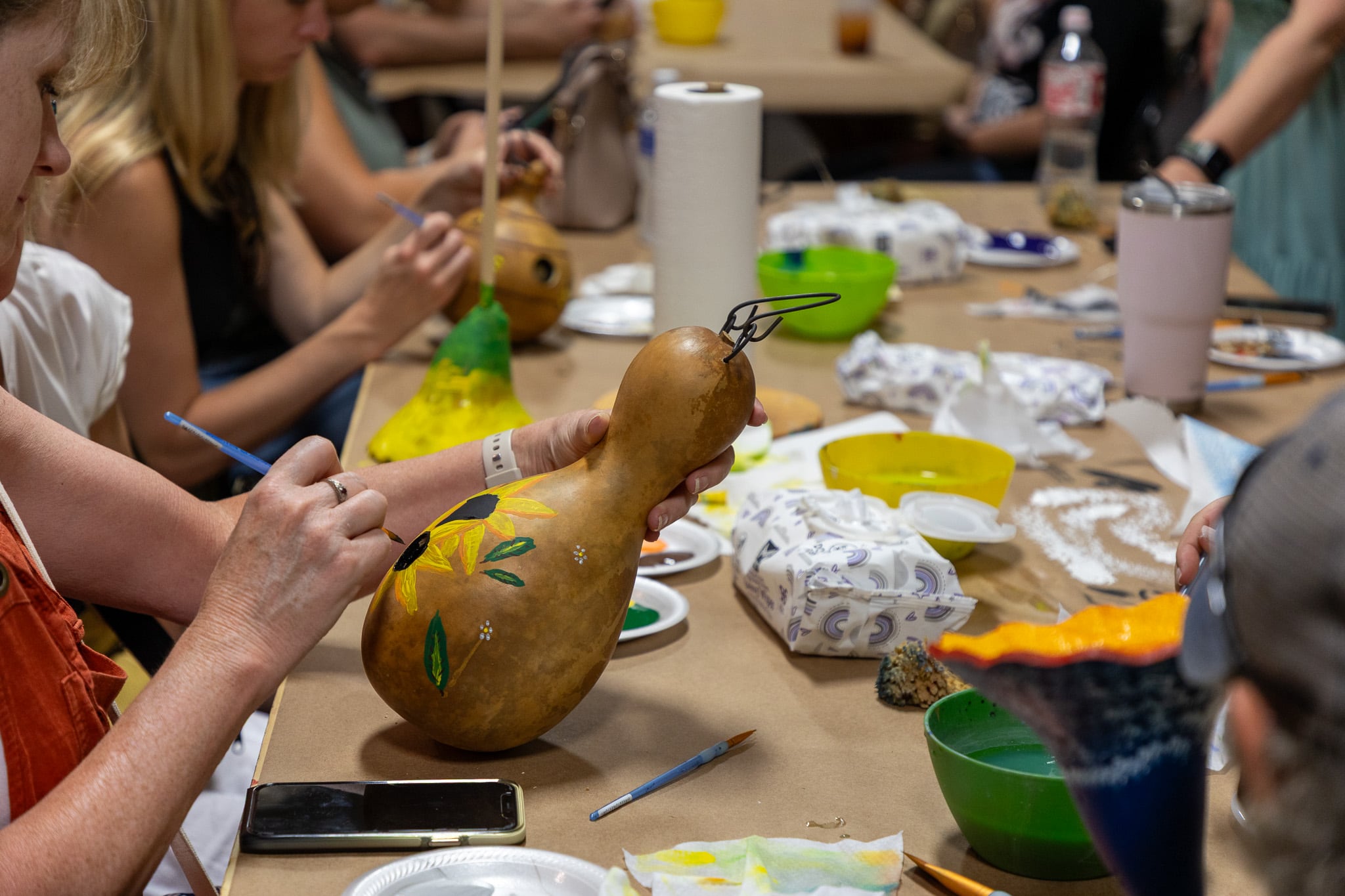Summer Celebration Painting birdhouses at Meadowbrooke Gourds. 