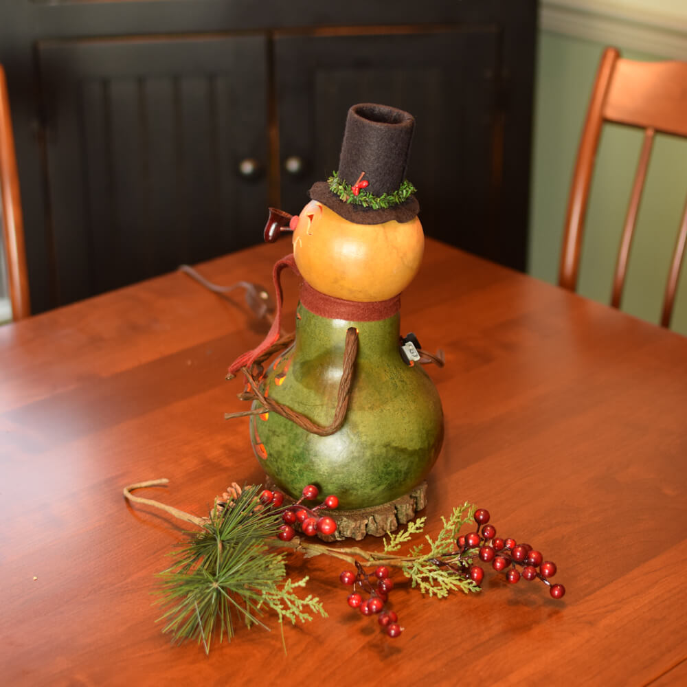 Small Lit Pinewood Snowman Gourd at Meadowbrooke Gourds. Left Side View
