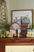 Wooden barn and house with pig and cow gourds