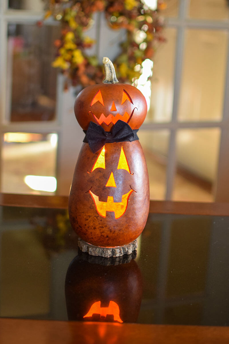 Lit two tier jack o lantern gourd at Meadowbrooke Gourds